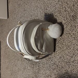 Girls white backpack with Pom